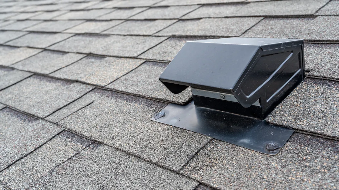 attic vents on a grey roof